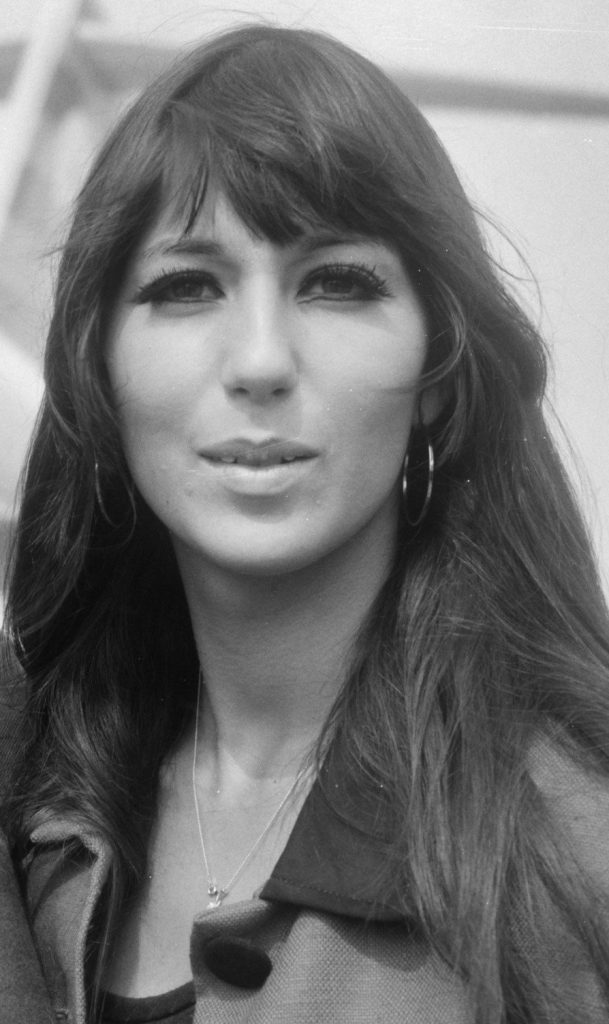 A young Cher leaving the airport in 1966.